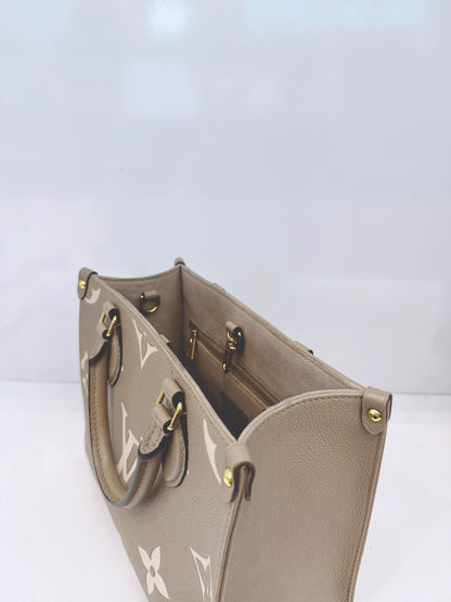 TOURTERELLE / CREAM MONOGRAM EMPREINTE LEATHER ONTHEGO PM HANDBAG