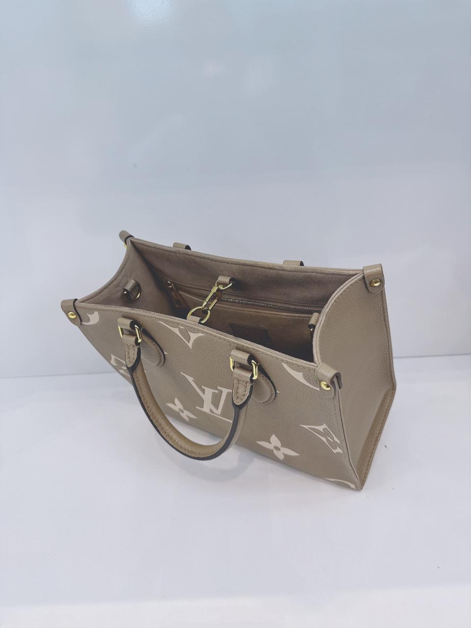 TOURTERELLE / CREAM MONOGRAM EMPREINTE LEATHER ONTHEGO PM HANDBAG