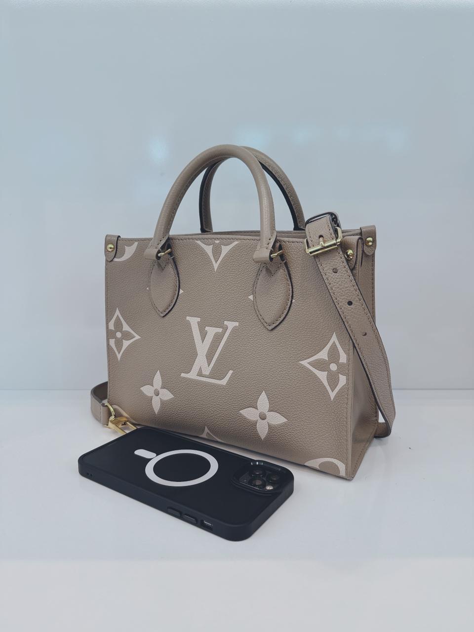 TOURTERELLE / CREAM MONOGRAM EMPREINTE LEATHER ONTHEGO PM HANDBAG