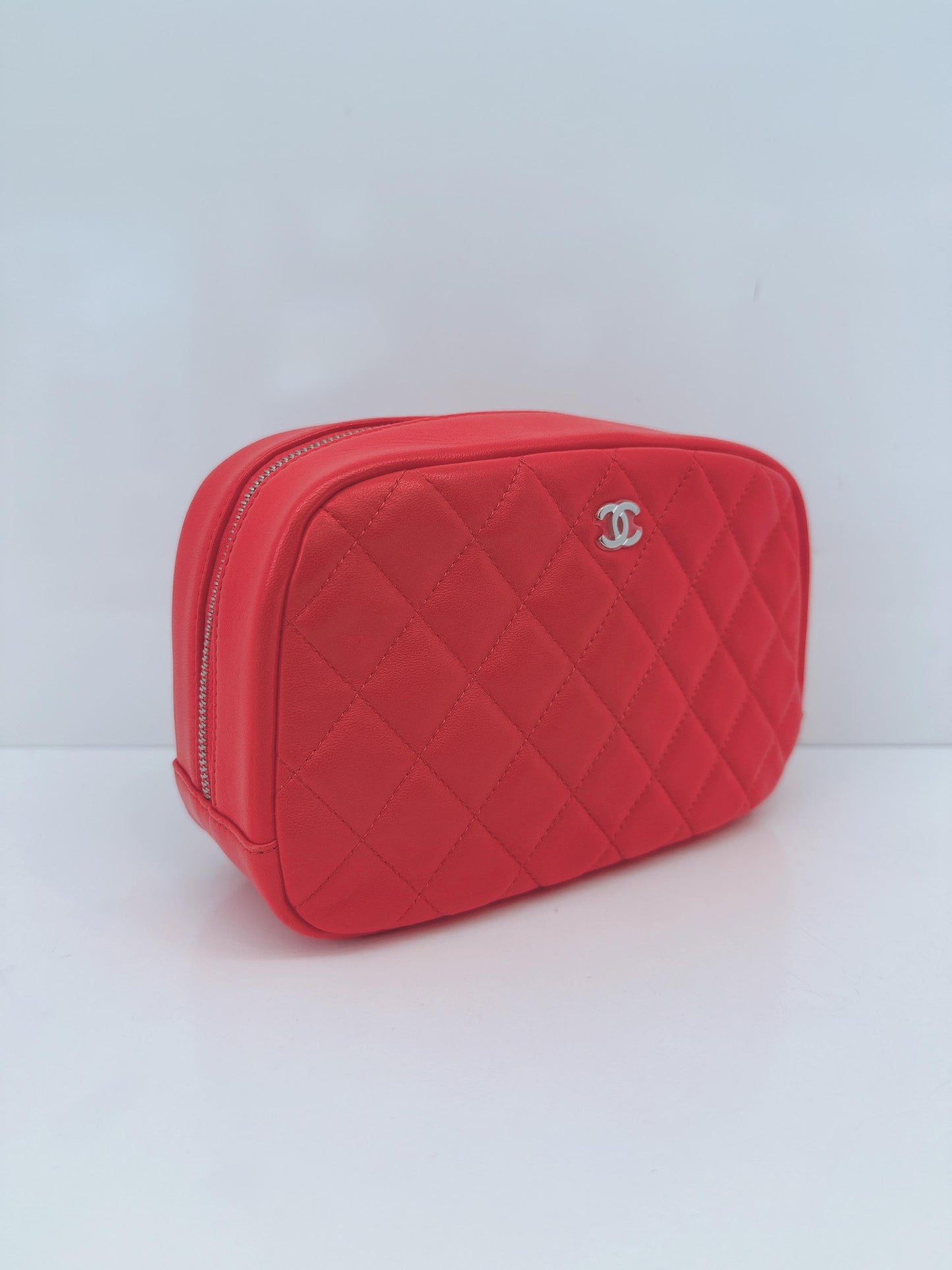CORAL QUILTED LAMBSKIN LEATHER CURVY POUCH COSMETIC CASE