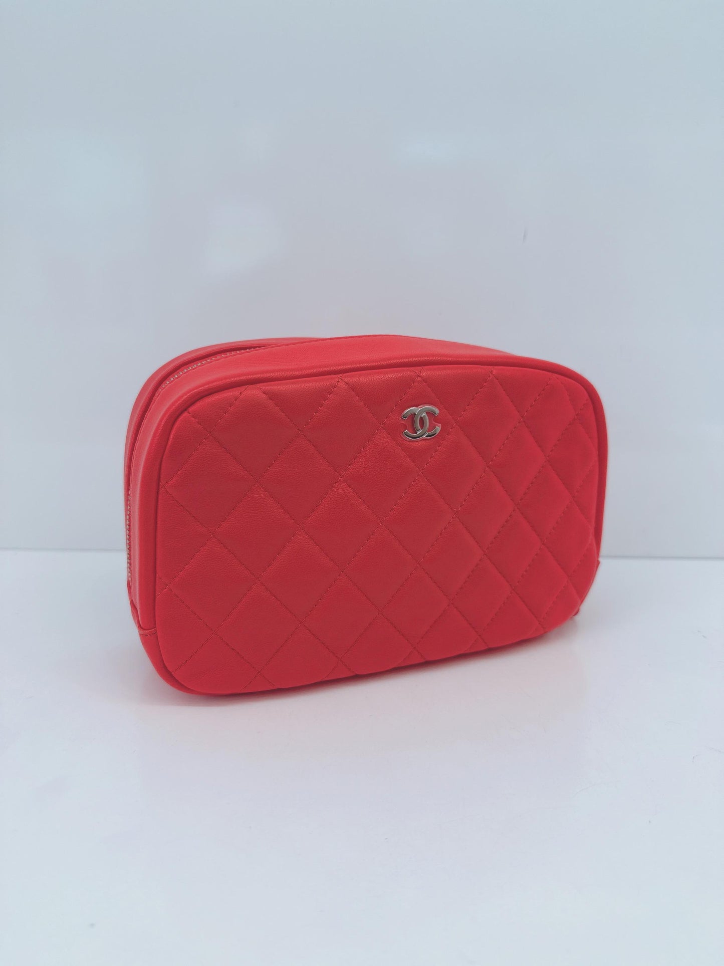 CORAL QUILTED LAMBSKIN LEATHER CURVY POUCH COSMETIC CASE