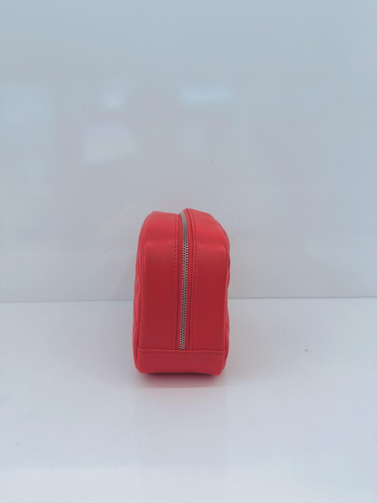 CORAL QUILTED LAMBSKIN LEATHER CURVY POUCH COSMETIC CASE