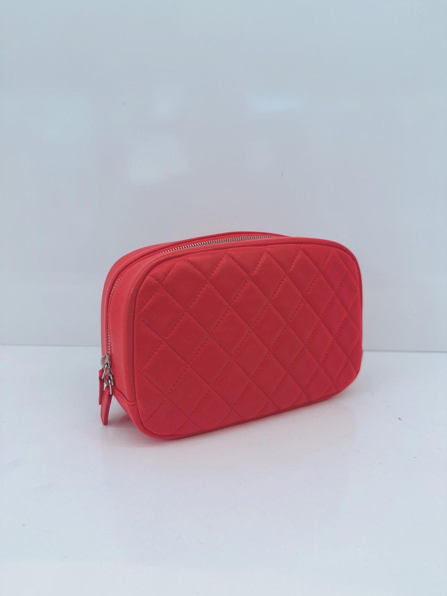 CORAL QUILTED LAMBSKIN LEATHER CURVY POUCH COSMETIC CASE