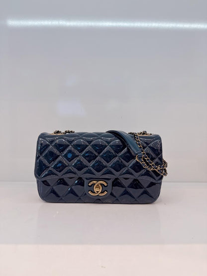 CHANEL BLUE PATENT GOATSKIN QUILTED SMALL CC EYELET FLAP BAG