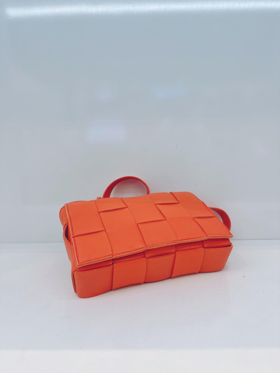 ORANGE LAMBSKIN INTRECCIATO CASSETTE CROSSBODY BAG