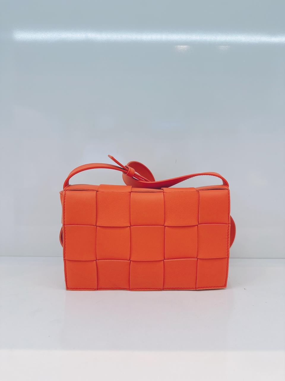 ORANGE LAMBSKIN INTRECCIATO CASSETTE CROSSBODY BAG