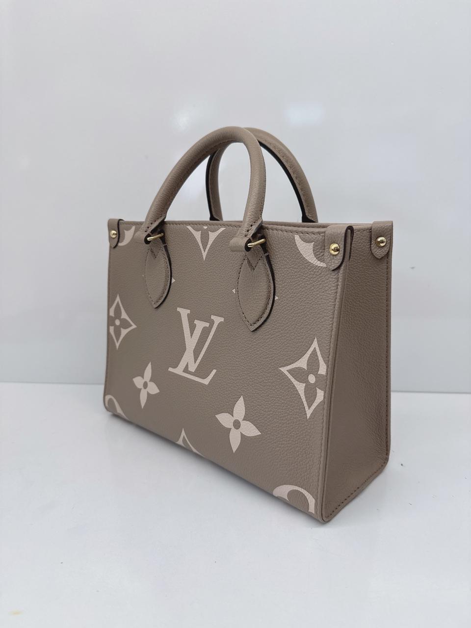 TOURTERELLE CRÈME BICOLOR MONOGRAM EMPREINTE LEATHER ONTHEGO PM TOTE BAG