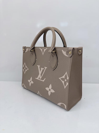 TOURTERELLE CRÈME BICOLOR MONOGRAM EMPREINTE LEATHER ONTHEGO PM TOTE BAG