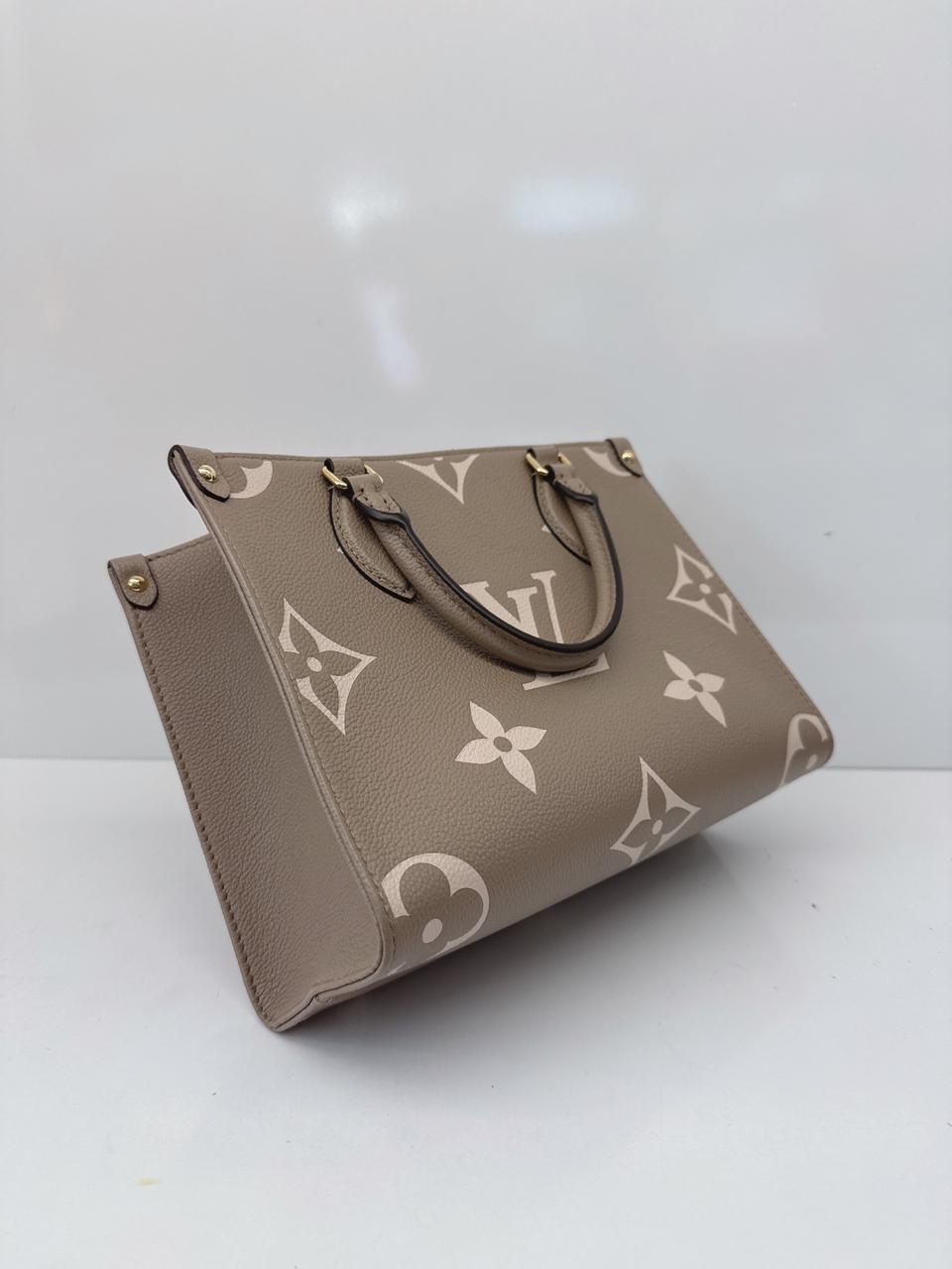 TOURTERELLE CRÈME BICOLOR MONOGRAM EMPREINTE LEATHER ONTHEGO PM TOTE BAG