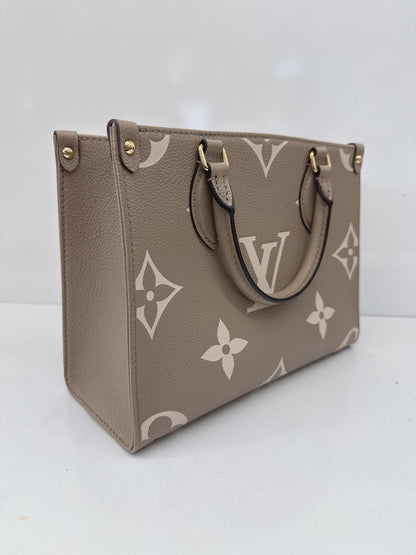 TOURTERELLE CRÈME BICOLOR MONOGRAM EMPREINTE LEATHER ONTHEGO PM TOTE BAG