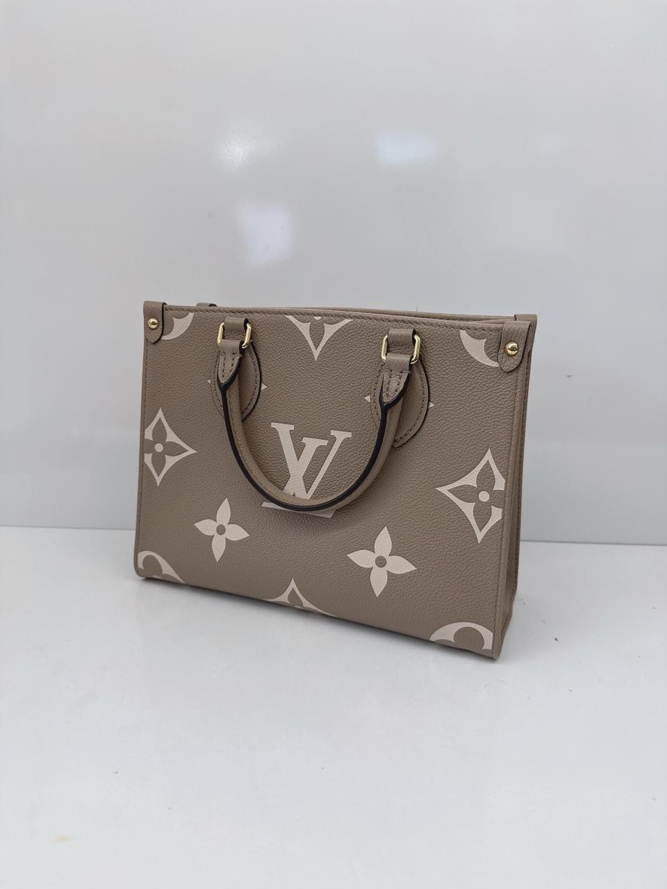 TOURTERELLE CRÈME BICOLOR MONOGRAM EMPREINTE LEATHER ONTHEGO PM TOTE BAG