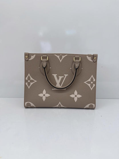TOURTERELLE CRÈME BICOLOR MONOGRAM EMPREINTE LEATHER ONTHEGO PM TOTE BAG