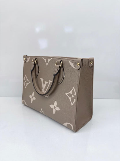 TOURTERELLE CRÈME BICOLOR MONOGRAM EMPREINTE LEATHER ONTHEGO PM TOTE BAG