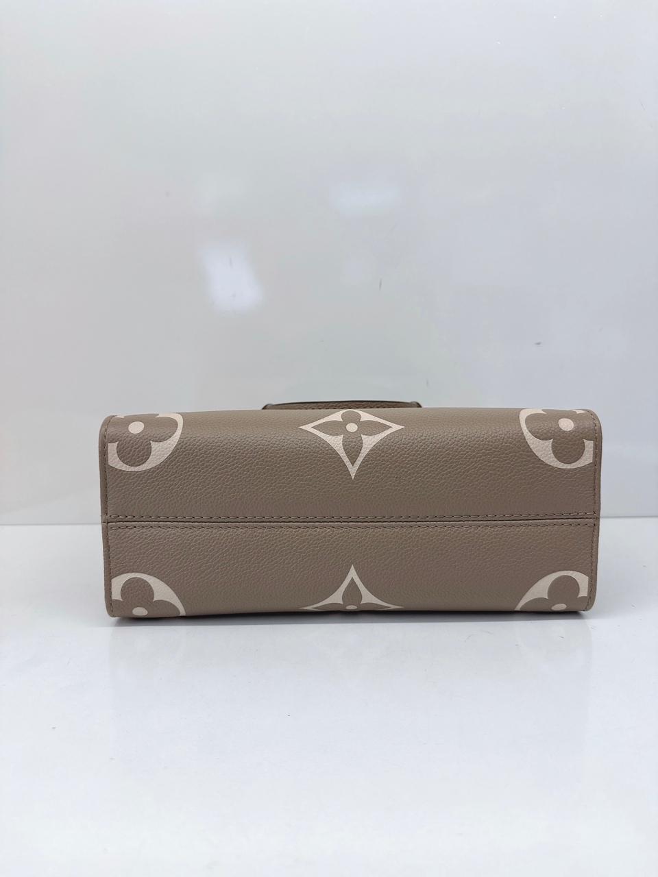 TOURTERELLE CRÈME BICOLOR MONOGRAM EMPREINTE LEATHER ONTHEGO PM TOTE BAG
