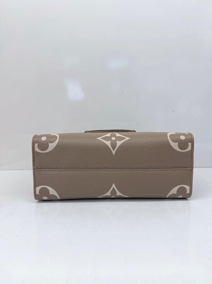 TOURTERELLE CRÈME BICOLOR MONOGRAM EMPREINTE LEATHER ONTHEGO PM TOTE BAG