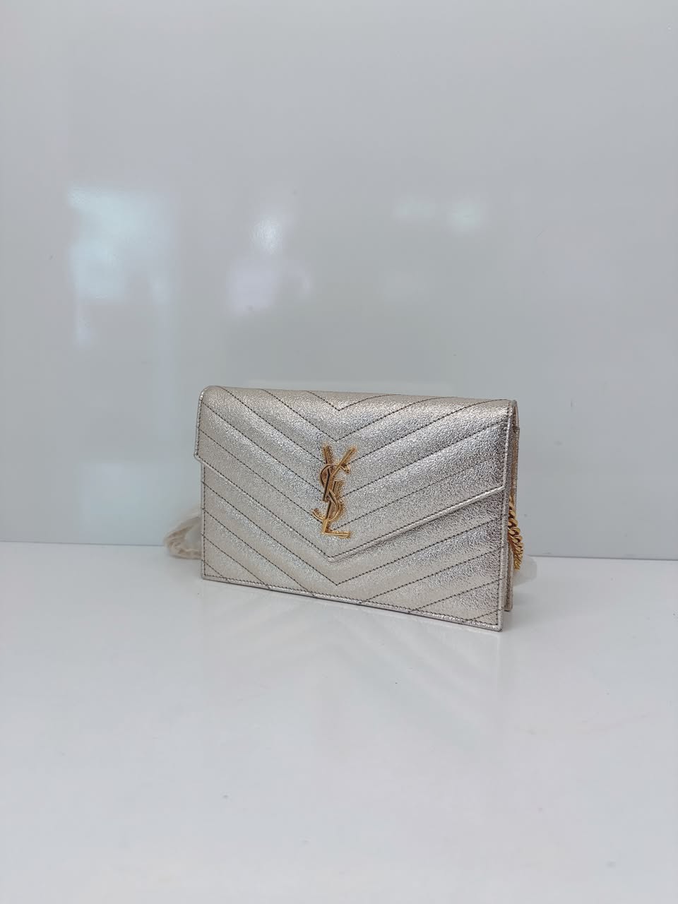 GOLD TEXTURED MONOGRAM SMALL CASSANDRE ENVELOPE WALLET ON CHAIN