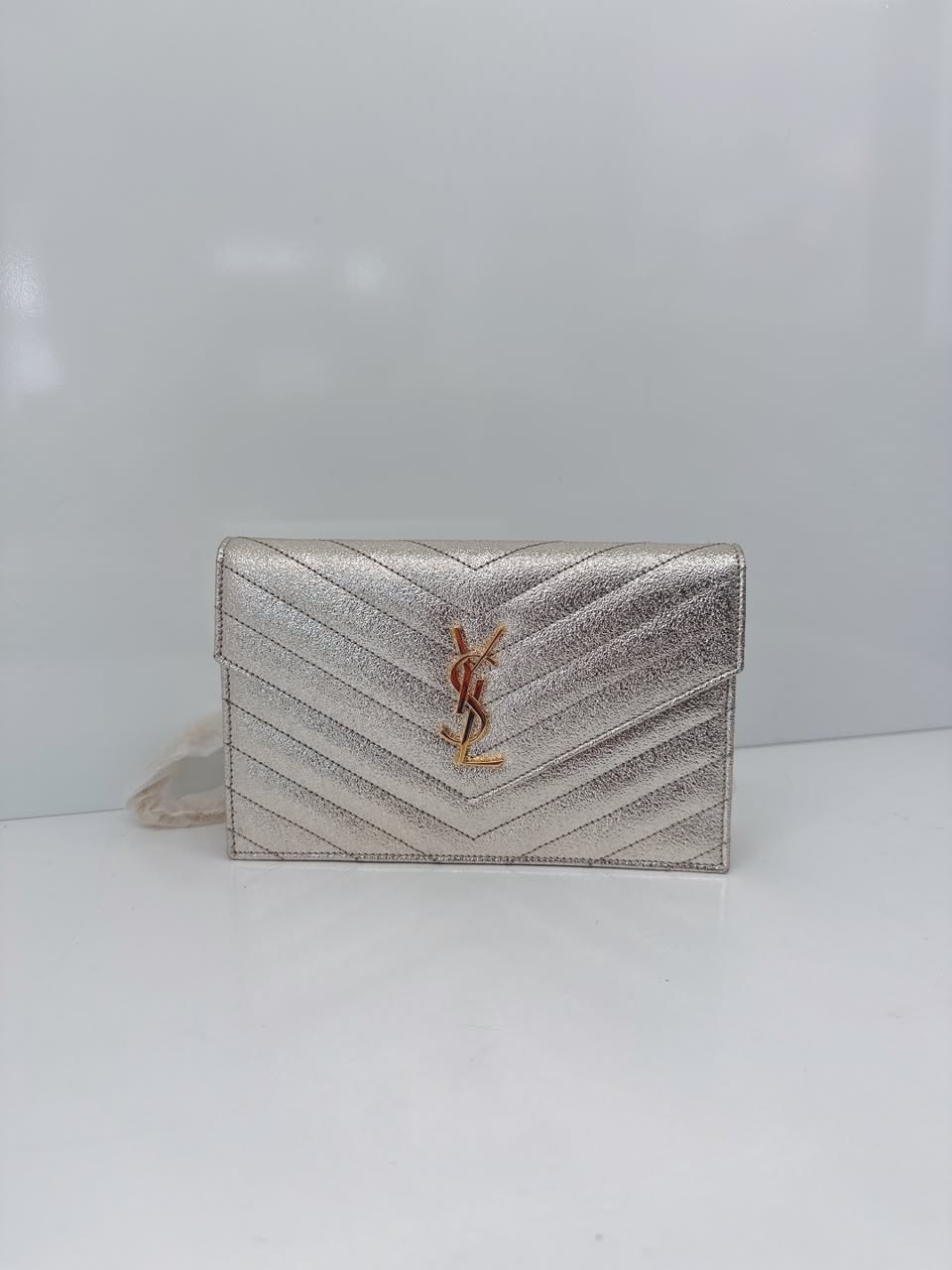 GOLD TEXTURED MONOGRAM SMALL CASSANDRE ENVELOPE WALLET ON CHAIN
