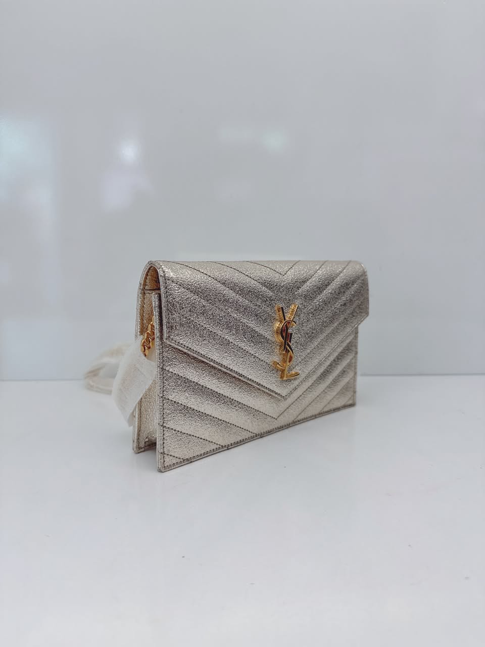 GOLD TEXTURED MONOGRAM SMALL CASSANDRE ENVELOPE WALLET ON CHAIN