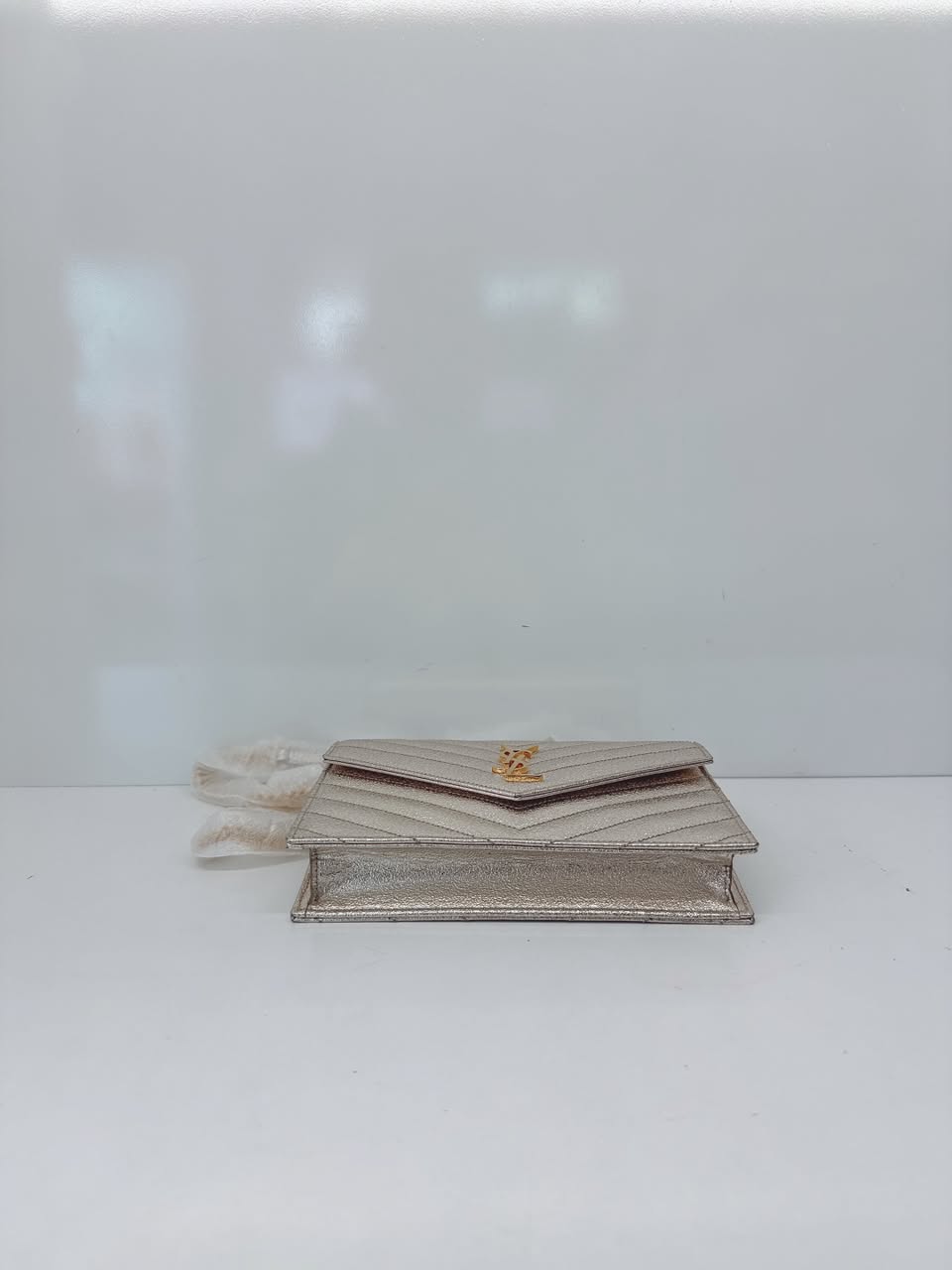 GOLD TEXTURED MONOGRAM SMALL CASSANDRE ENVELOPE WALLET ON CHAIN