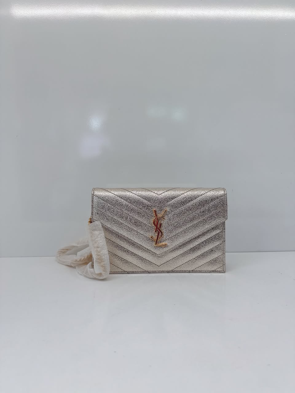 GOLD TEXTURED MONOGRAM SMALL CASSANDRE ENVELOPE WALLET ON CHAIN