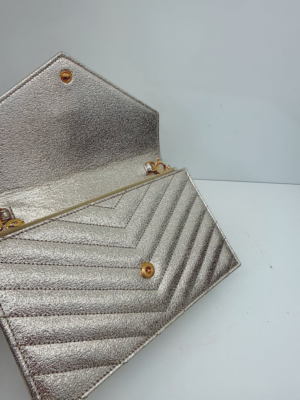 GOLD TEXTURED MONOGRAM SMALL CASSANDRE ENVELOPE WALLET ON CHAIN
