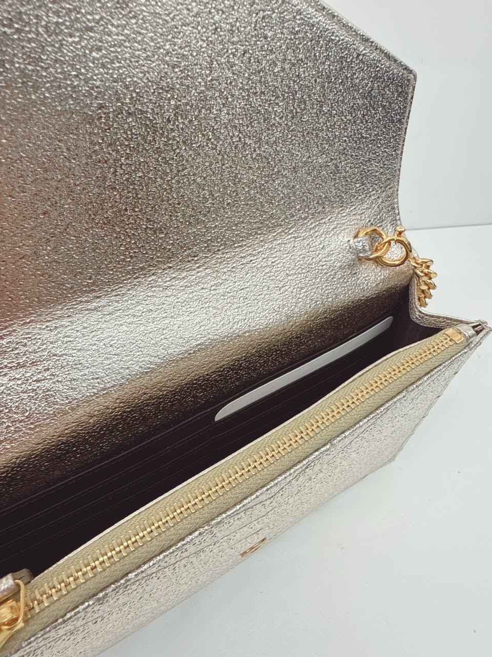 GOLD TEXTURED MONOGRAM SMALL CASSANDRE ENVELOPE WALLET ON CHAIN