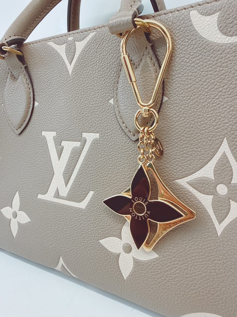 GOLD TONE AND BLACK ENAMEL PUZZLE KEY RING AND BAG CHARM