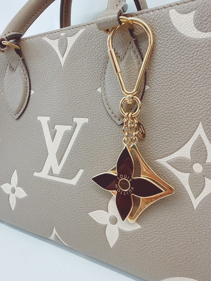 GOLD TONE AND BLACK ENAMEL PUZZLE KEY RING AND BAG CHARM