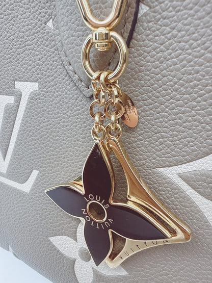 GOLD TONE AND BLACK ENAMEL PUZZLE KEY RING AND BAG CHARM