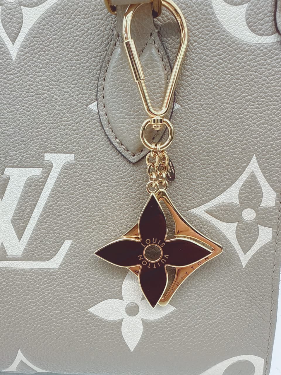 GOLD TONE AND BLACK ENAMEL PUZZLE KEY RING AND BAG CHARM
