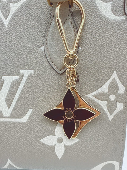 GOLD TONE AND BLACK ENAMEL PUZZLE KEY RING AND BAG CHARM