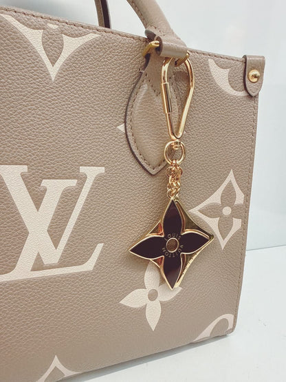 GOLD TONE AND BLACK ENAMEL PUZZLE KEY RING AND BAG CHARM