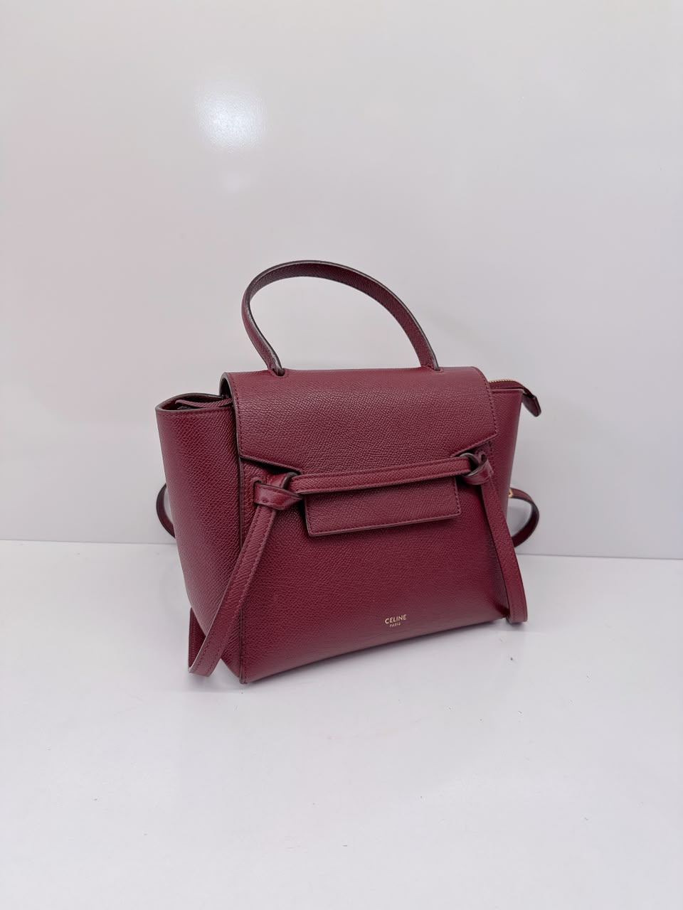 BURGUNDY LEATHER NANO BELT TOP HANDLE BAG
