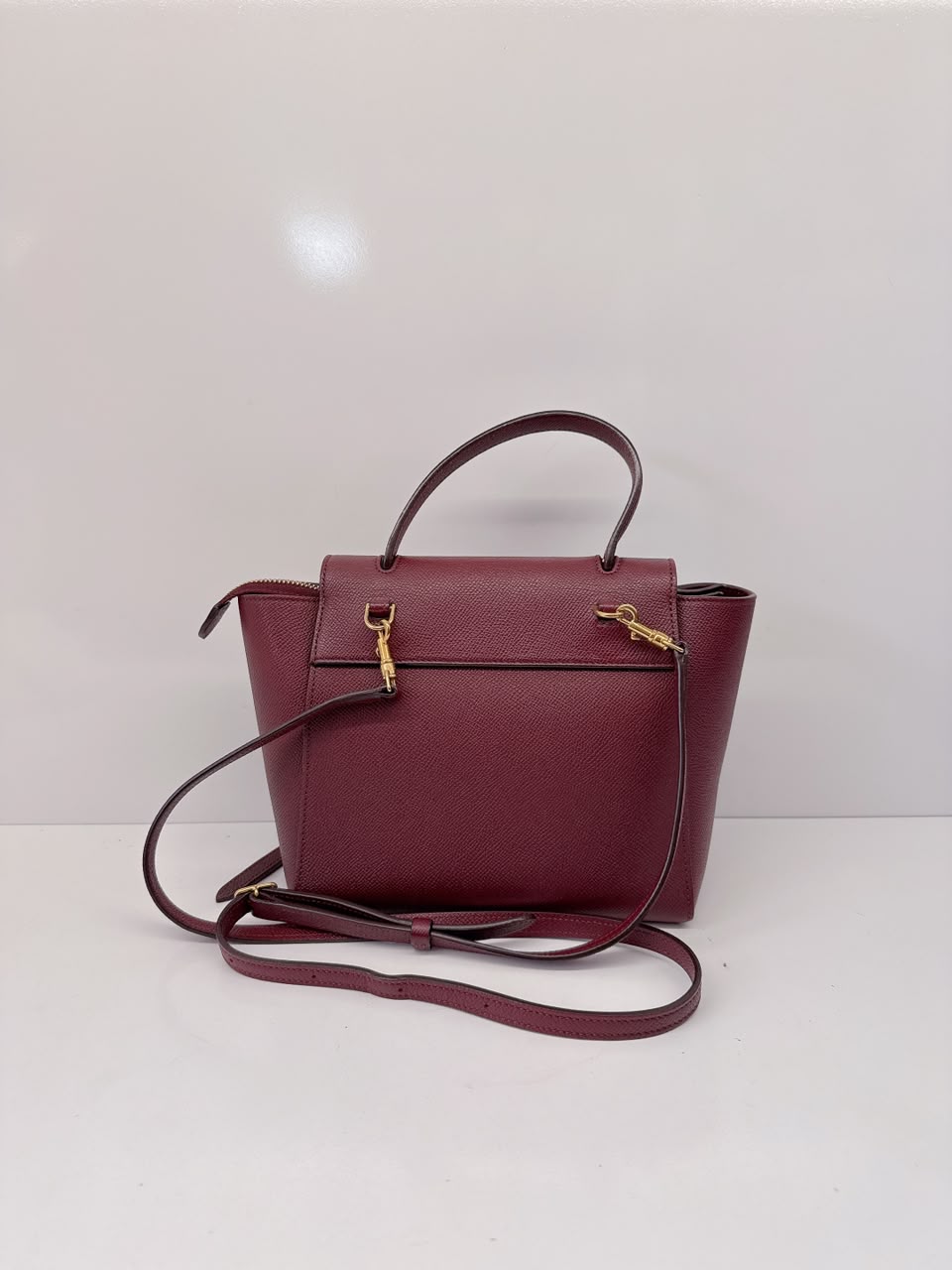 BURGUNDY LEATHER NANO BELT TOP HANDLE BAG
