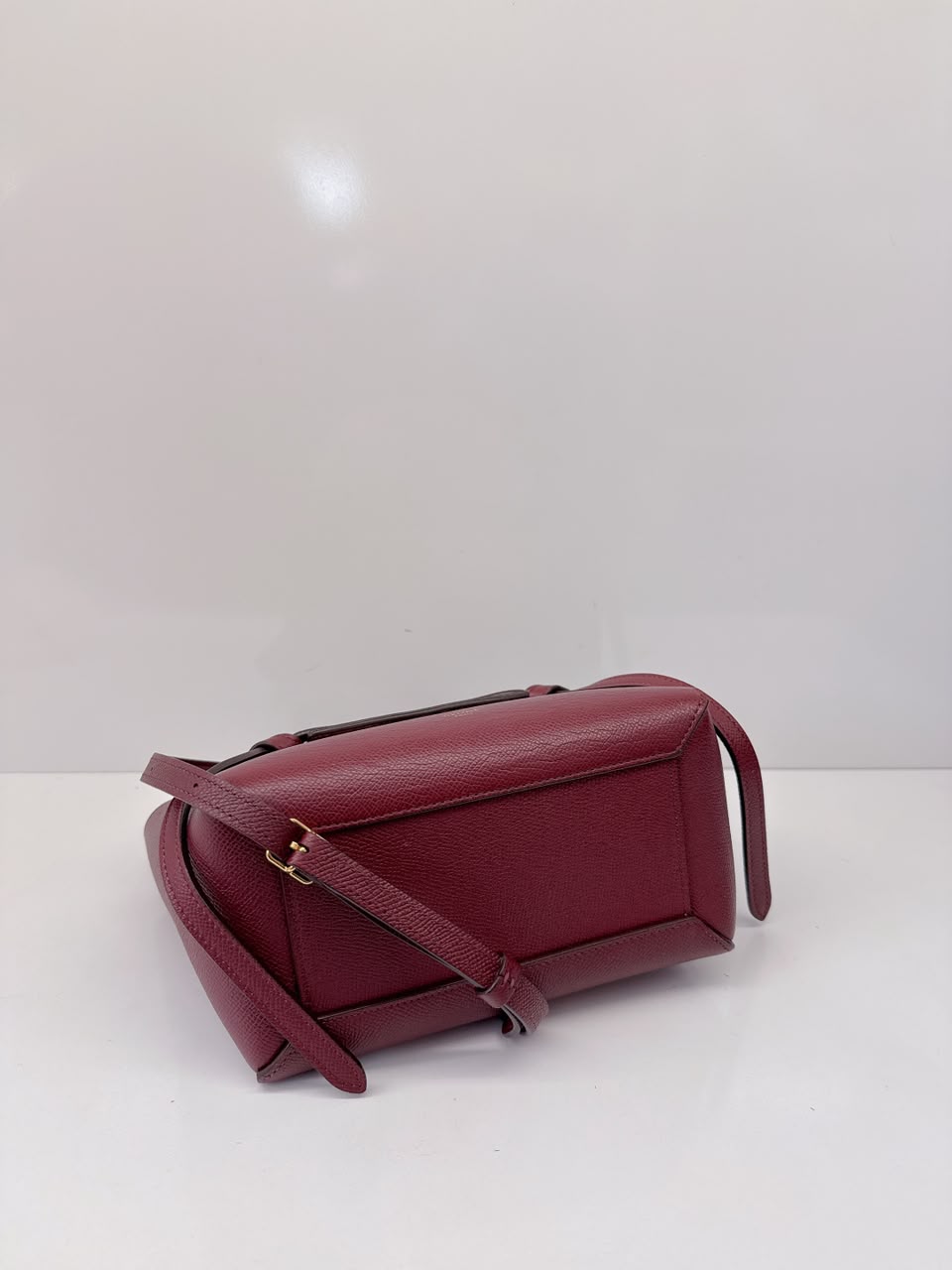 BURGUNDY LEATHER NANO BELT TOP HANDLE BAG