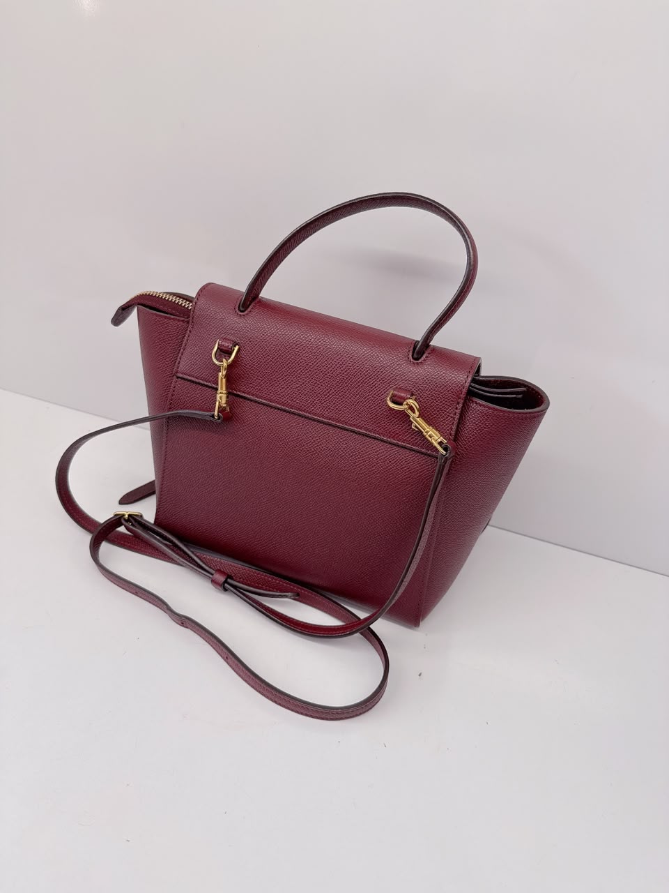 BURGUNDY LEATHER NANO BELT TOP HANDLE BAG