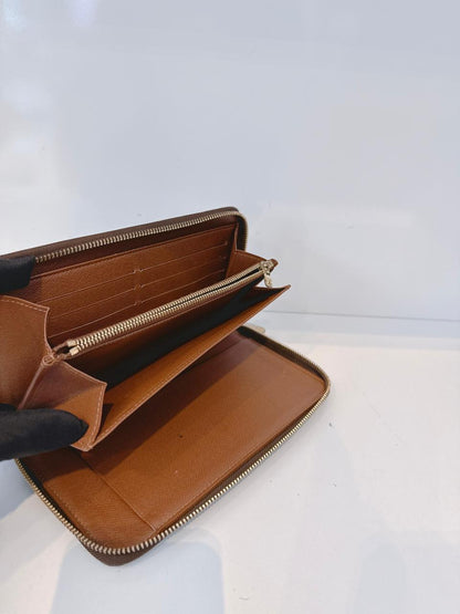 BROWN MONOGRAM CANVAS ZIPPY ORGANIZER WALLET