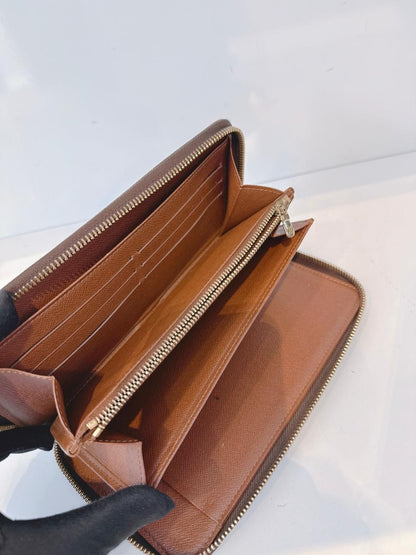 BROWN MONOGRAM CANVAS ZIPPY ORGANIZER WALLET