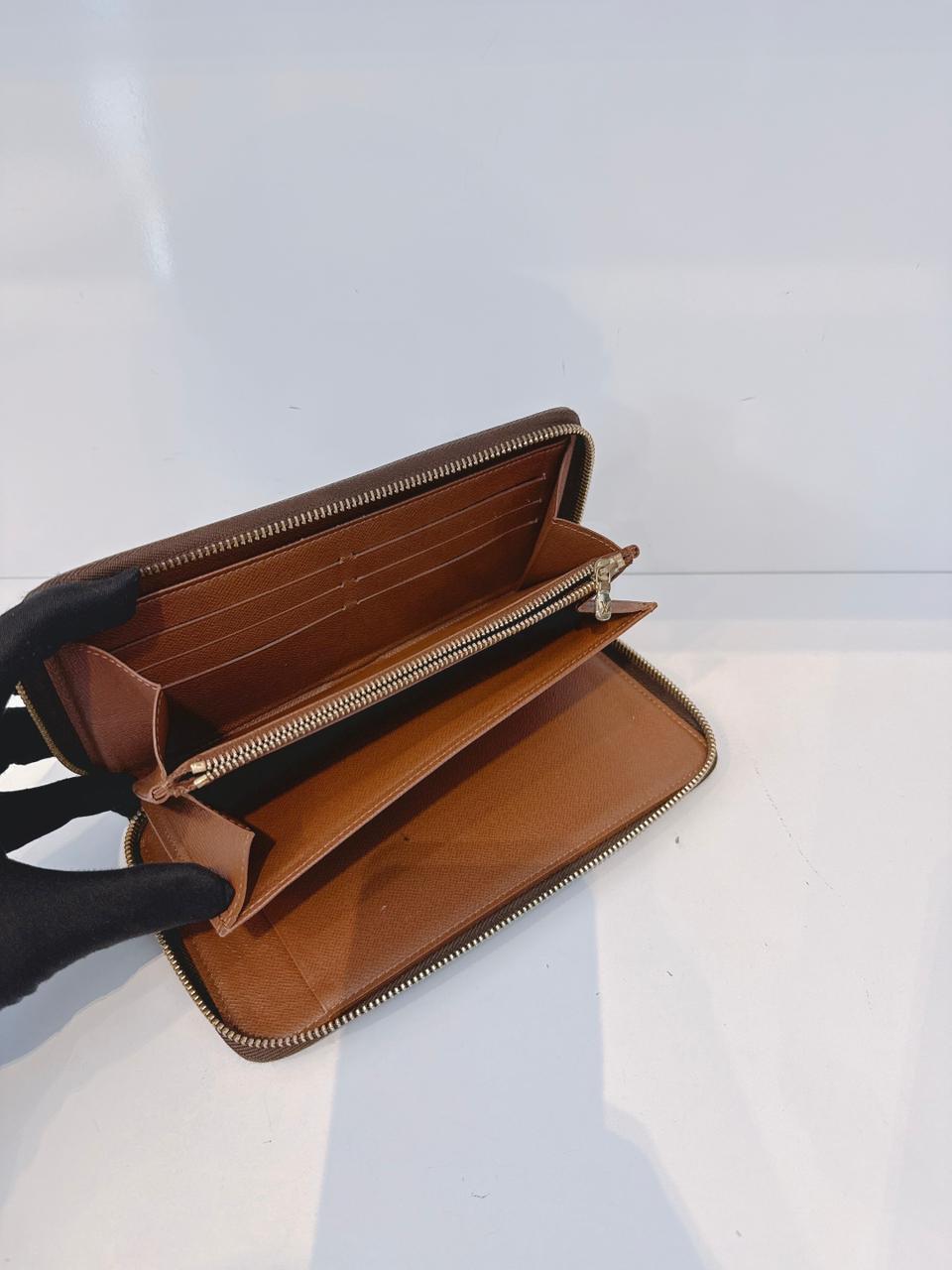 BROWN MONOGRAM CANVAS ZIPPY ORGANIZER WALLET