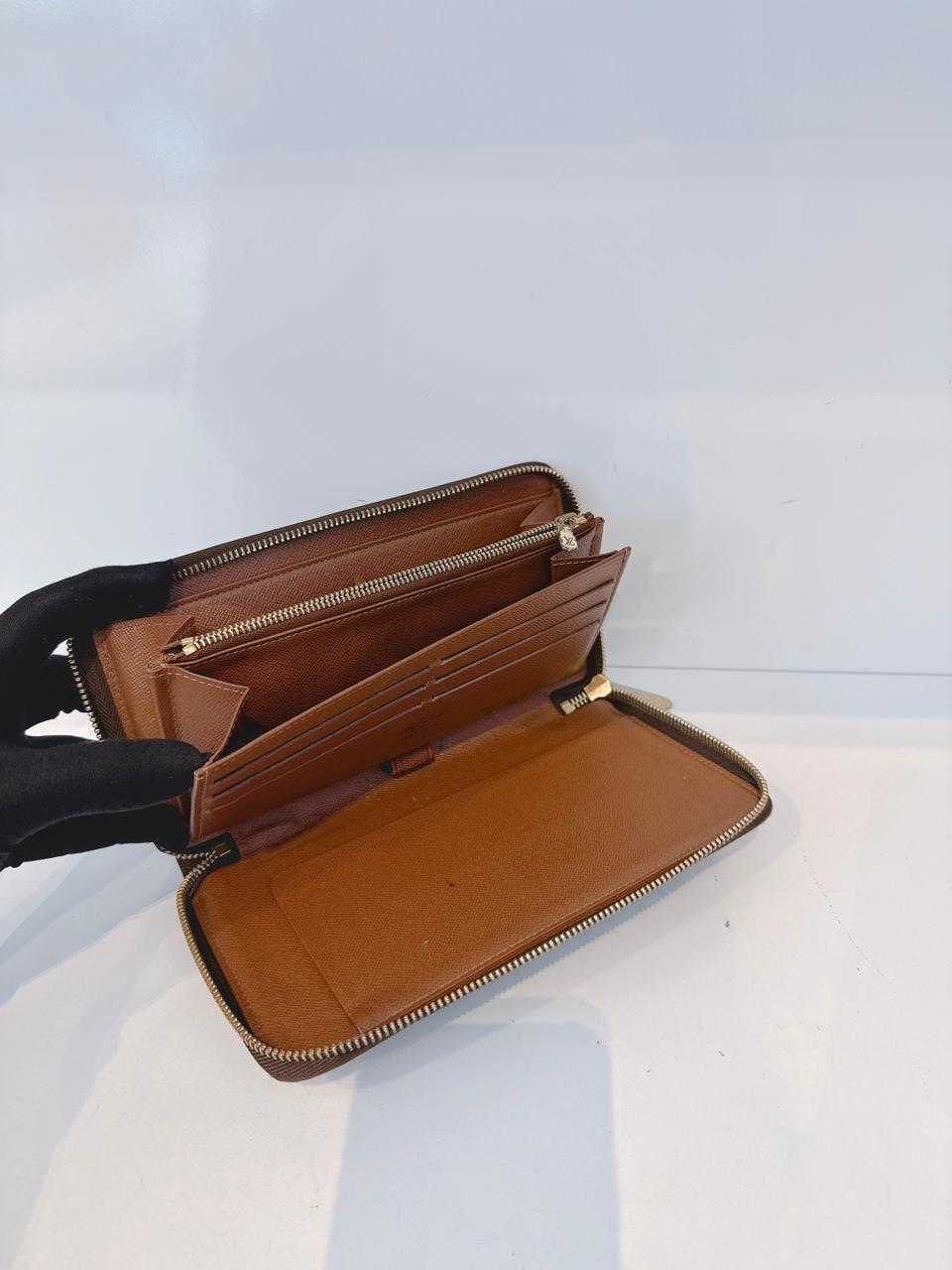 BROWN MONOGRAM CANVAS ZIPPY ORGANIZER WALLET