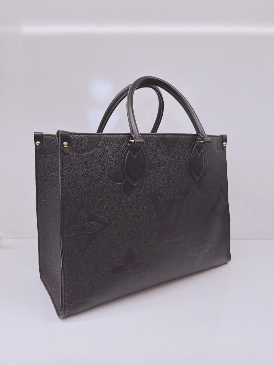 BLACK MONOGRAM EMPREINTE LEATHER ONTHEGO MM TOTE BAG