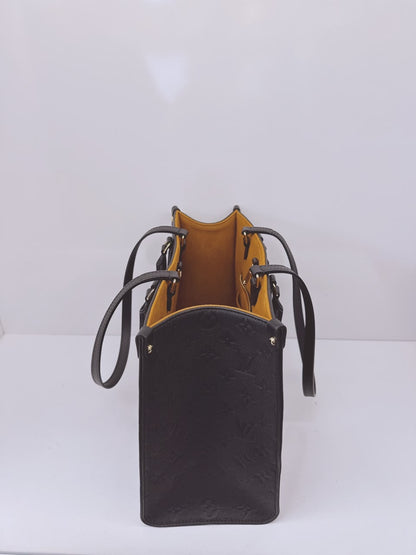 BLACK MONOGRAM EMPREINTE LEATHER ONTHEGO MM TOTE BAG