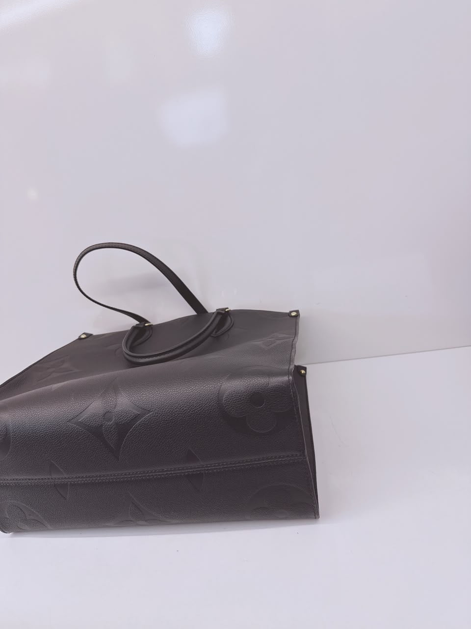 BLACK MONOGRAM EMPREINTE LEATHER ONTHEGO MM TOTE BAG