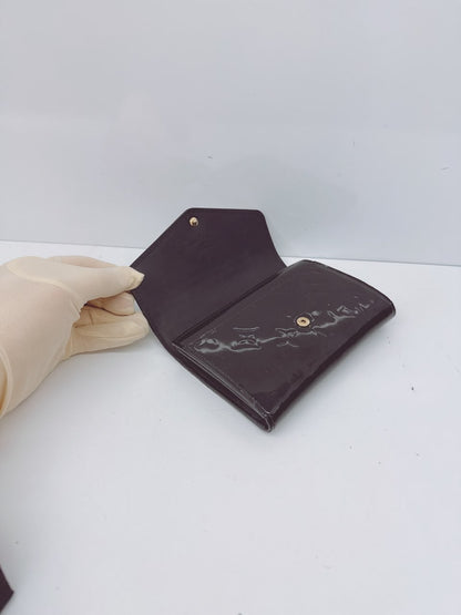 BLACK MONOGRAM VERNIS SARAH NW WALLET