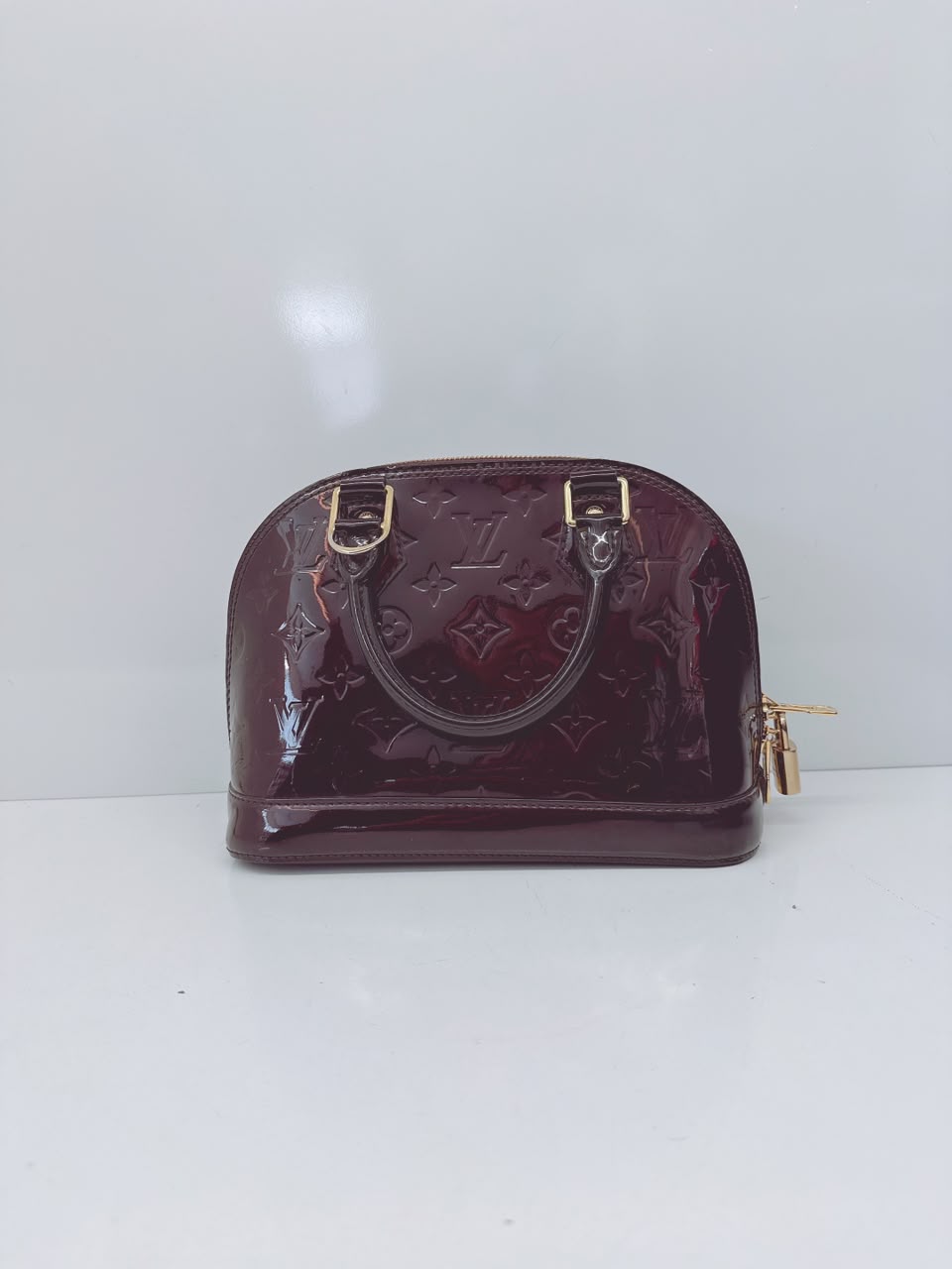 AMARANTE MONOGRAM VERNIS ALMA BB BAG