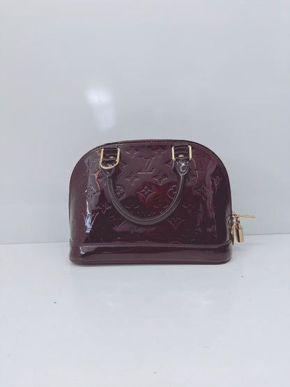 AMARANTE MONOGRAM VERNIS ALMA BB BAG