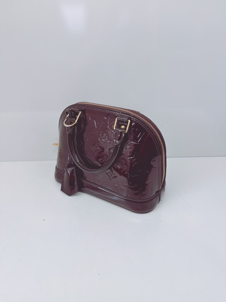 AMARANTE MONOGRAM VERNIS ALMA BB BAG
