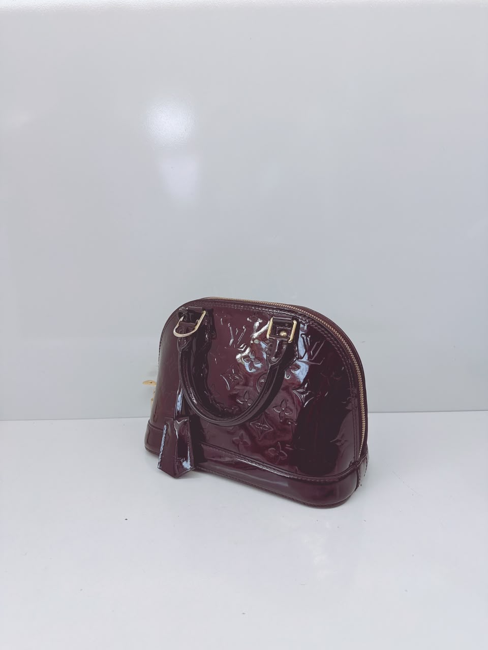 AMARANTE MONOGRAM VERNIS ALMA BB BAG