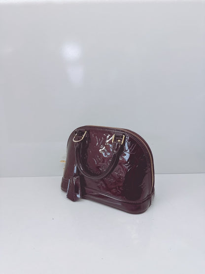 AMARANTE MONOGRAM VERNIS ALMA BB BAG