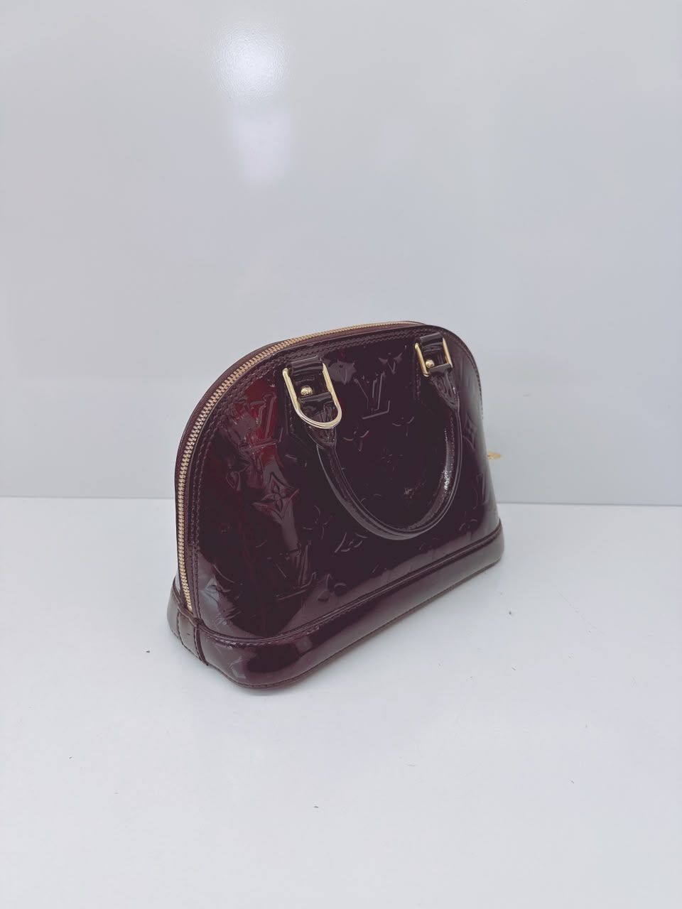 AMARANTE MONOGRAM VERNIS ALMA BB BAG